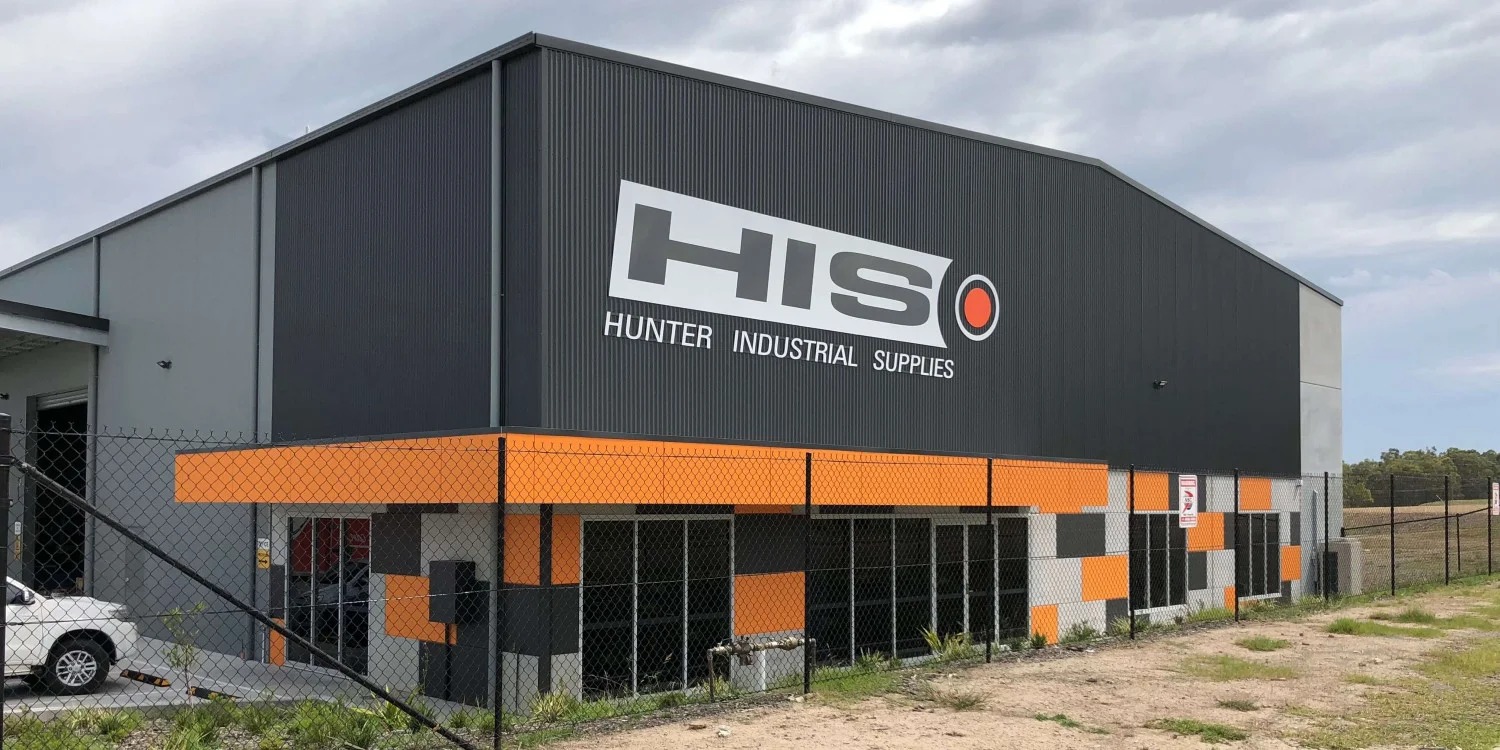 Commercial building signage with illuminated channel letters