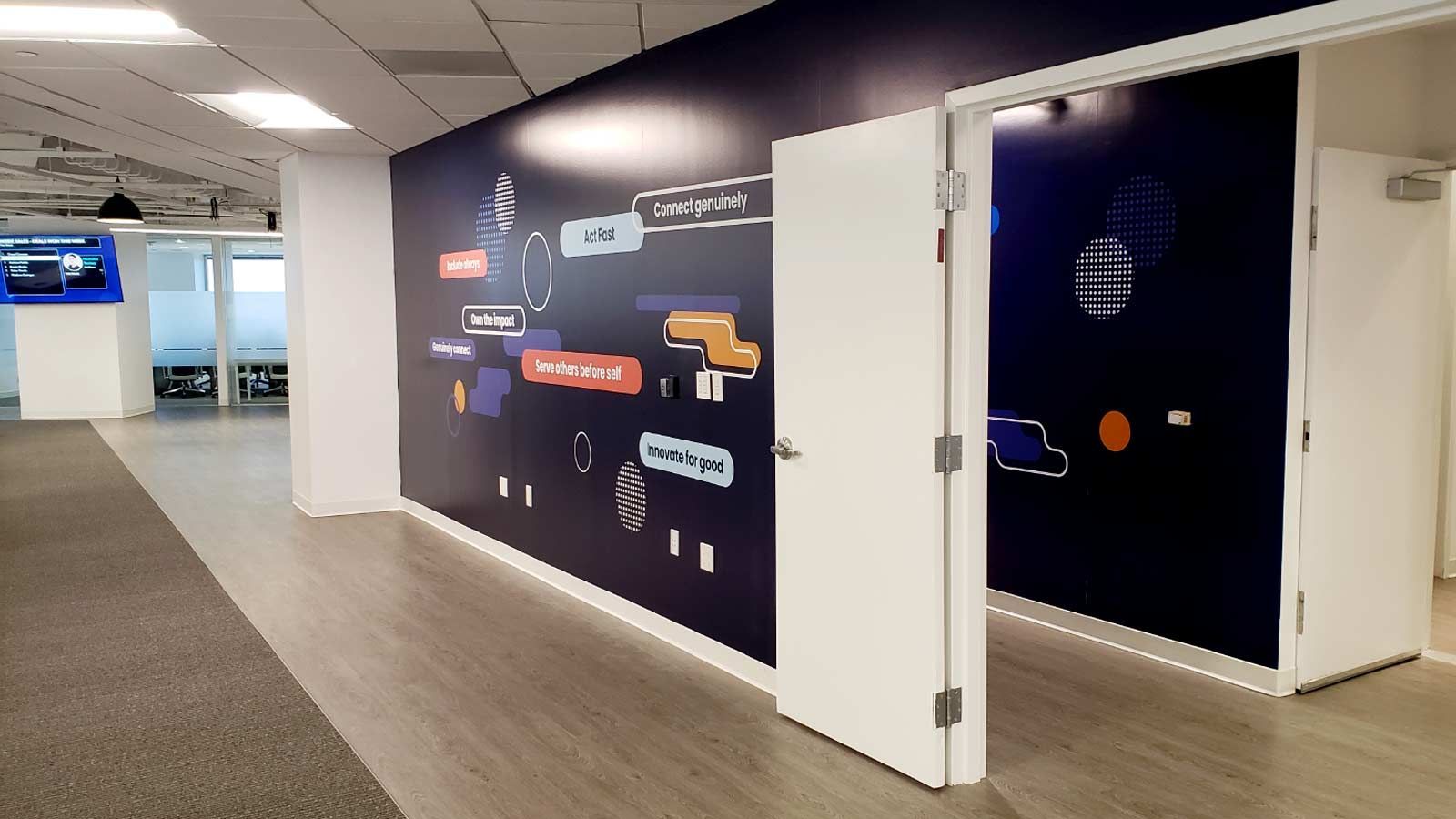 Custom printed wall panels and office branding graphics